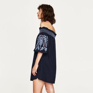 Dress with embroidered sleeves